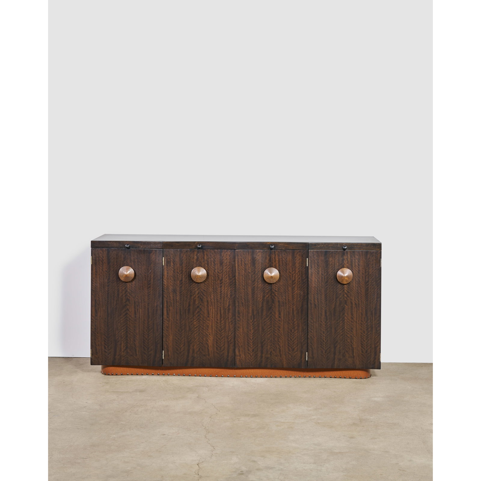 GILBERT ROHDE (1894-1944) 'Paldao' Credenzacirca 1940for Herman Miller Furniture Company, walnut...: GILBERT ROHDE (1894-1944) 'Paldao' Credenza circa 1940 for Herman Miller Furniture Company, walnut, brass height 34in (86.4cm); length 72in (183cm); width 19in (48.3cm) Footnotes: Provenance The Evan 