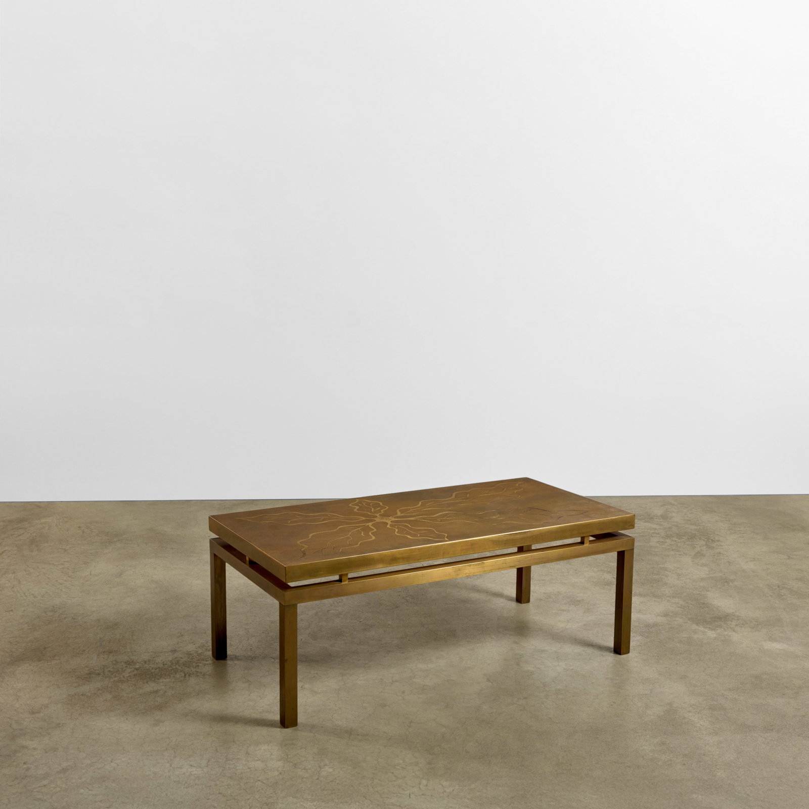 WILLY DARO (1918-1990) Coffee Tablecirca 1975acid-etched gilt brassheight 19 3/4in (50cm); width...: WILLY DARO (1918-1990) Coffee Table circa 1975 acid-etched gilt brass height 19 3/4in (50cm); width 51 1/4in (130cm); depth 25 1/2in (65cm) This lot is subject to the following lot symbols: W W