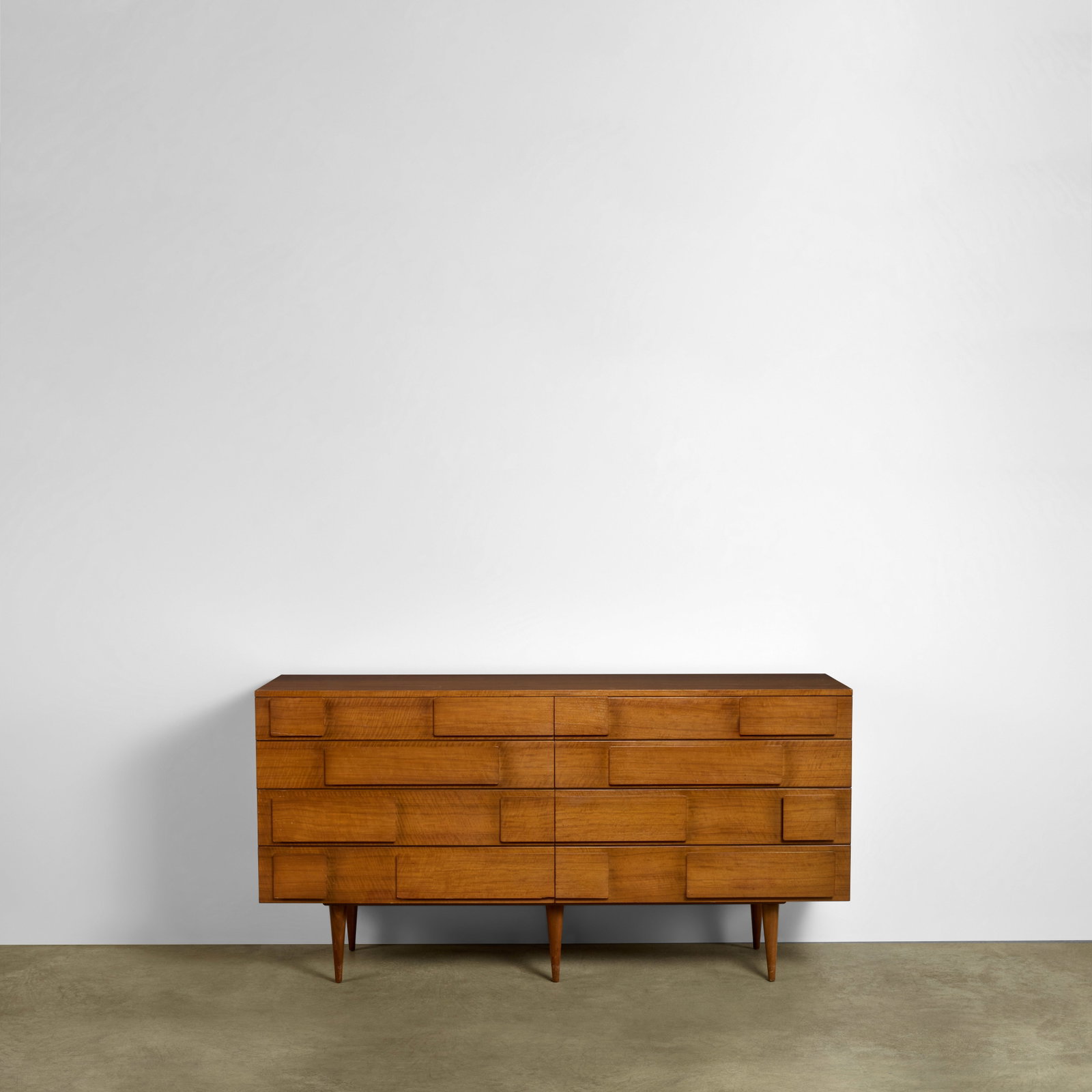 GIO PONTI (1891-1979) Double Chestcirca 1955for Singer & Sons, walnut, paper label 'M. Singer &...: GIO PONTI (1891-1979) Double Chest circa 1955 for Singer & Sons, walnut, paper label 'M. Singer & Sons New York Chicago' height 36 1/2in (93cm); 72in (183cm); depth 19 3/4in (50cm) Footnotes: Literatu