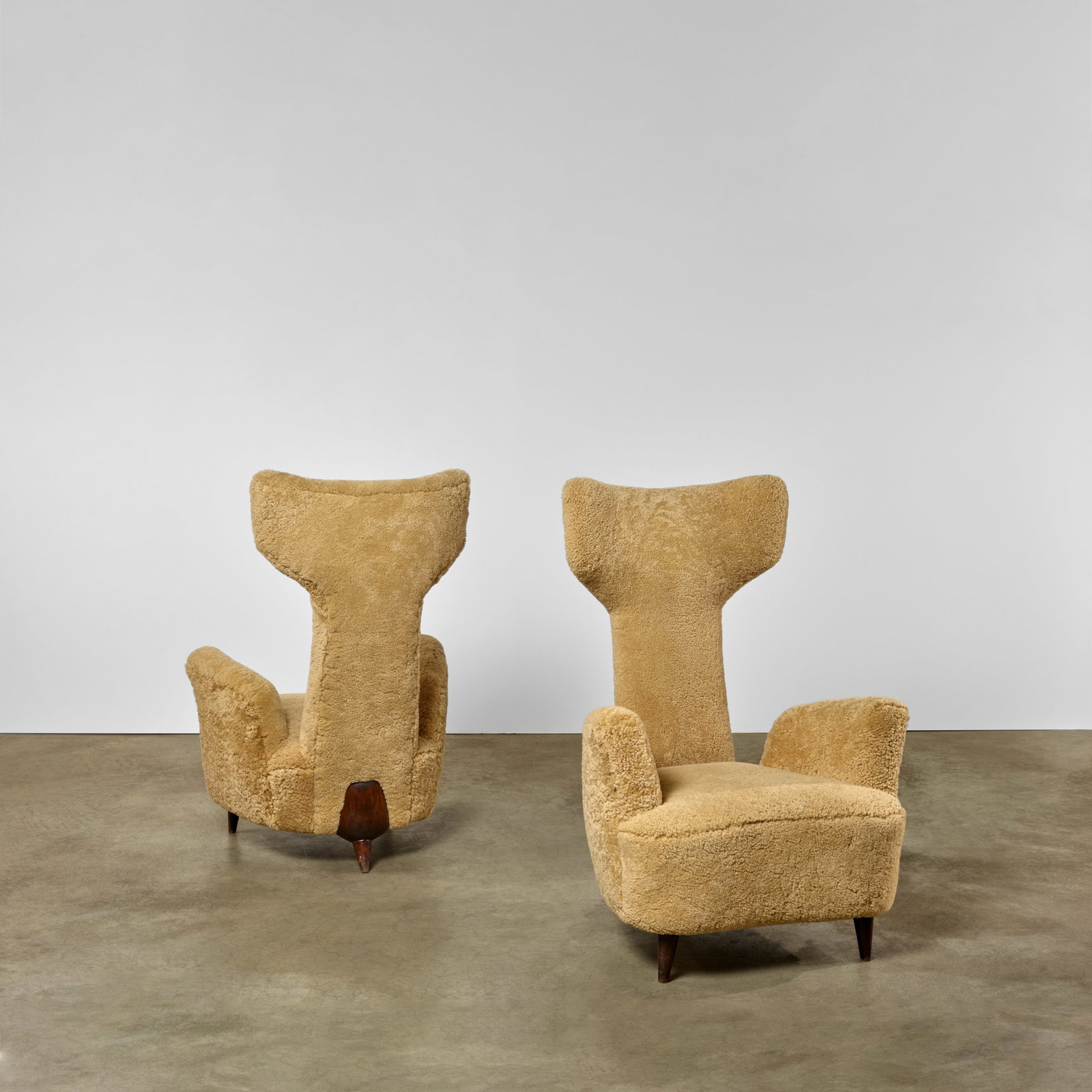 RENZO ZAVENELLA (1900-1988) Pair of Lounge Chairs circa 1955sheepskin upholstery, oakheight 45in... (1 of 1)