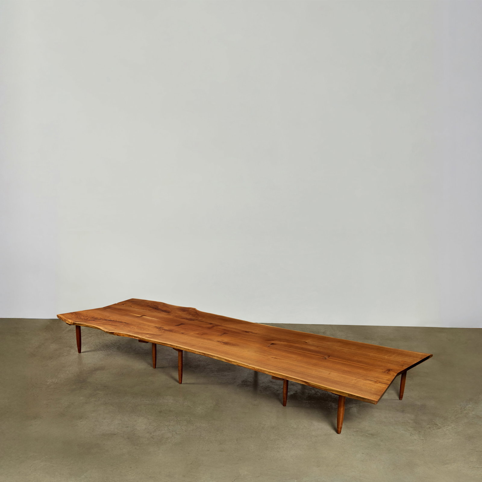 MIRA NAKASHIMA (BORN 1942) Custom Order Monumental Bench2004American black walnut, rosewood, lea... (1 of 1)