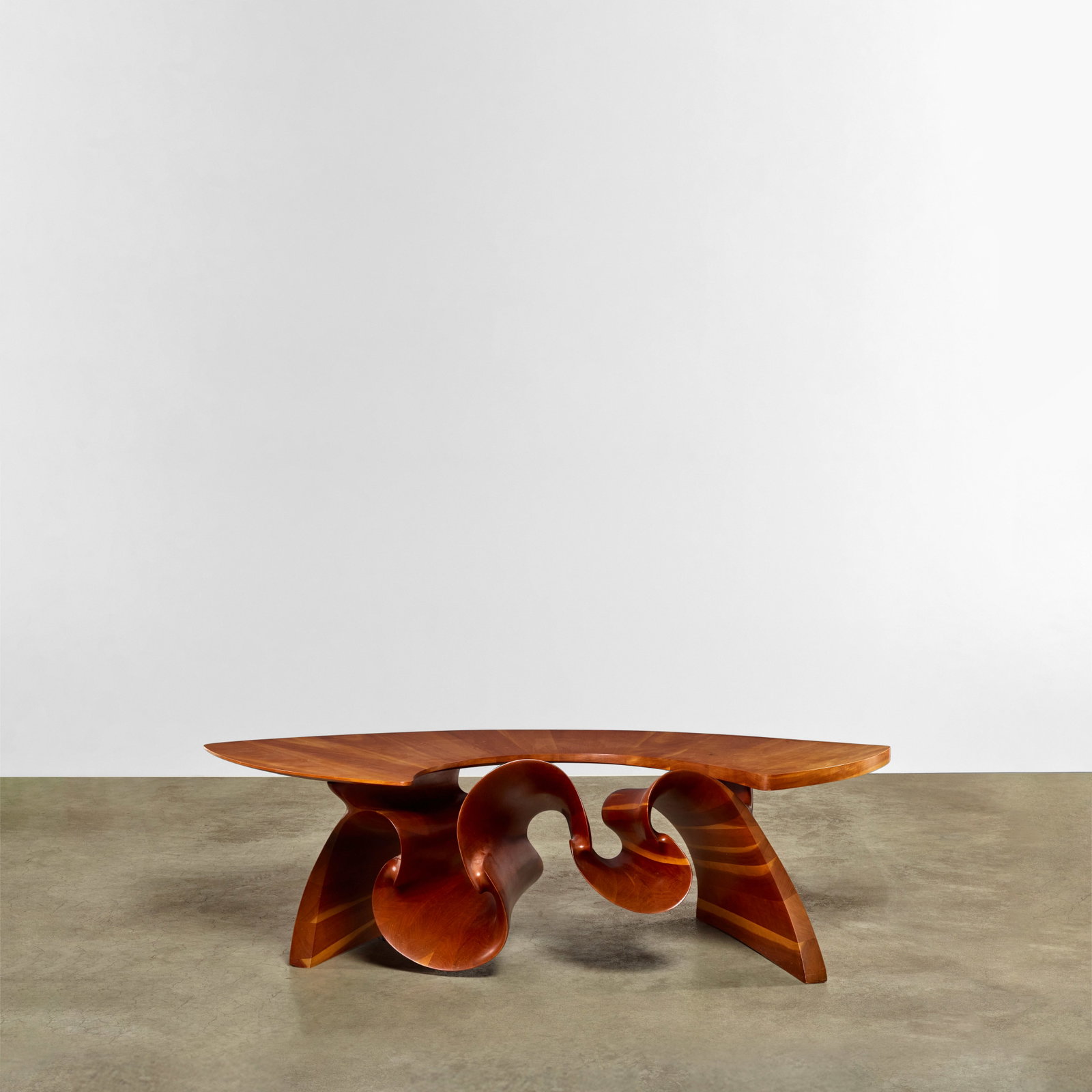 PETER MICHAEL ADAMS (BORN 1946) 'Ribbon' Coffee Table circa 1970carved and laminated cherry, bra... (1 of 1)