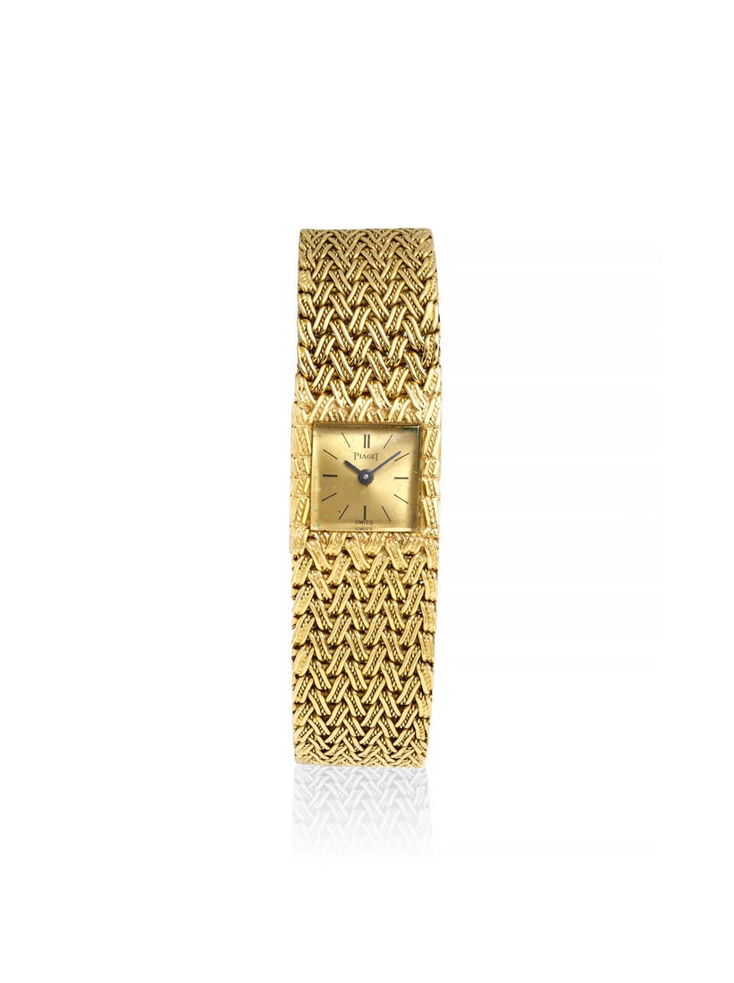 PIAGET. AN 18K GOLD BACKWIND BRACELET WATCHRef: 3813 D 1, c. 1970s: PIAGET. AN 18K GOLD BACKWIND BRACELET WATCH Reference: 3813 D 1 Date: c. 1970s Movement: Jeweled manual wind, no. 33543 Dial: Champagne Case: Square, snap on case back, no. 86383 Strap/Bracelet: 18k