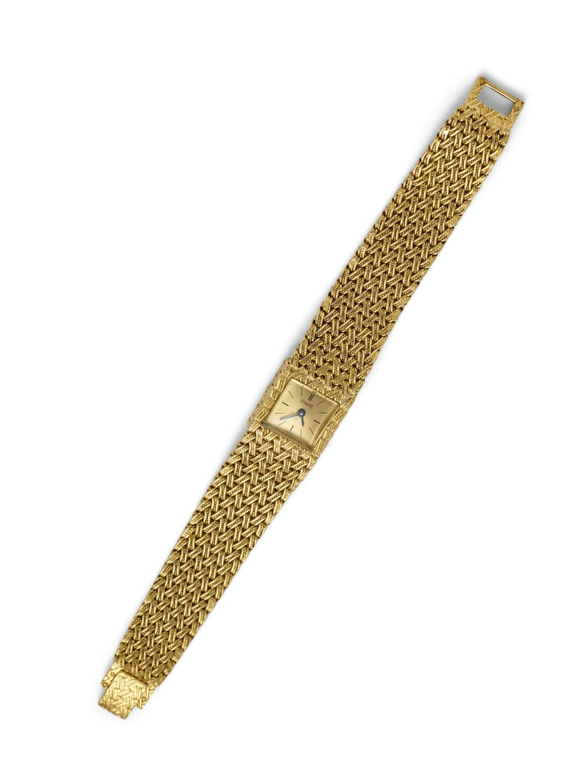 PIAGET. AN 18K GOLD BACKWIND BRACELET WATCHRef: 3813 D 1, c. 1970s - 2