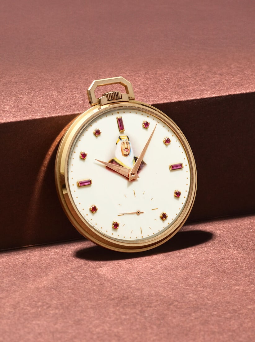 PATEK PHILIPPE. A RARE 18K ROSE GOLD AND RUBY SET KEYLESS WIND OPEN FACE WATCH MADE IN HOMAGE OF...: PATEK PHILIPPE. A RARE 18K ROSE GOLD AND RUBY SET KEYLESS WIND OPEN FACE WATCH MADE IN HOMAGE OF KING SAUD BIN ABDULAZIZ AL SAUDI Reference: 600/1 Date: Purchased 28th February, 1956 Movement: Cal. 17