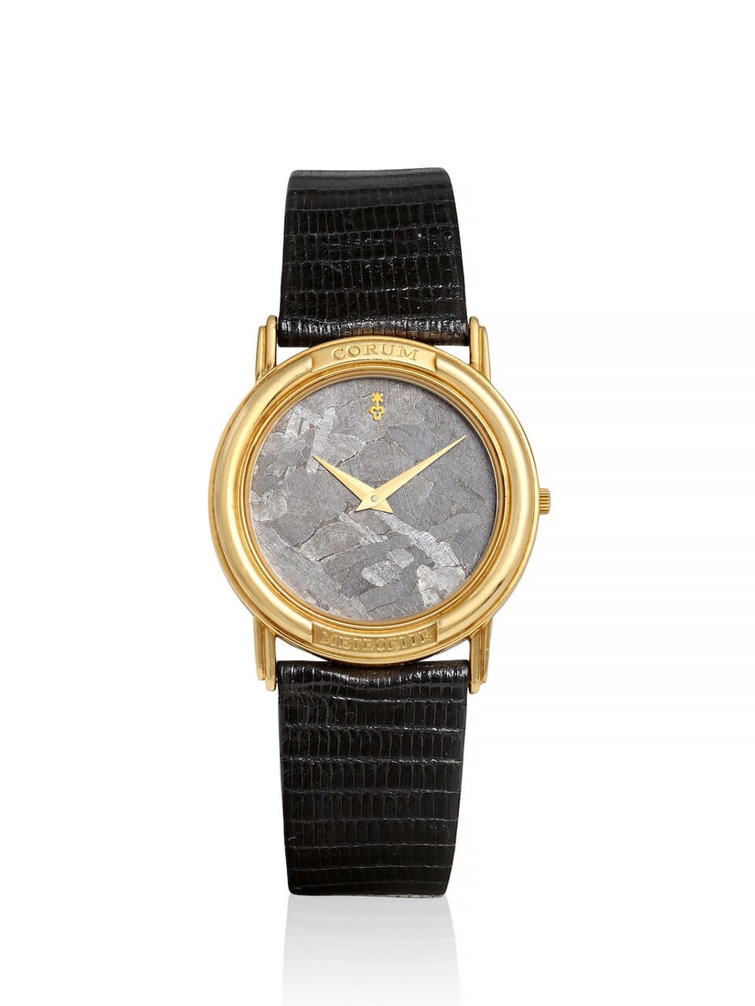 [NO RESERVE] CORUM. AN 18K GOLD QUARTZ WRISTWATCH WITH METEORITE DIALRef: 50.450.56, c. 1995: [NO RESERVE] CORUM. AN 18K GOLD QUARTZ WRISTWATCH WITH METEORITE DIAL Reference: 50.450.56 Date: c. 1995 Movement: 8-jewel quartz, no. 299191 (movement in need of service, please refer to condition re