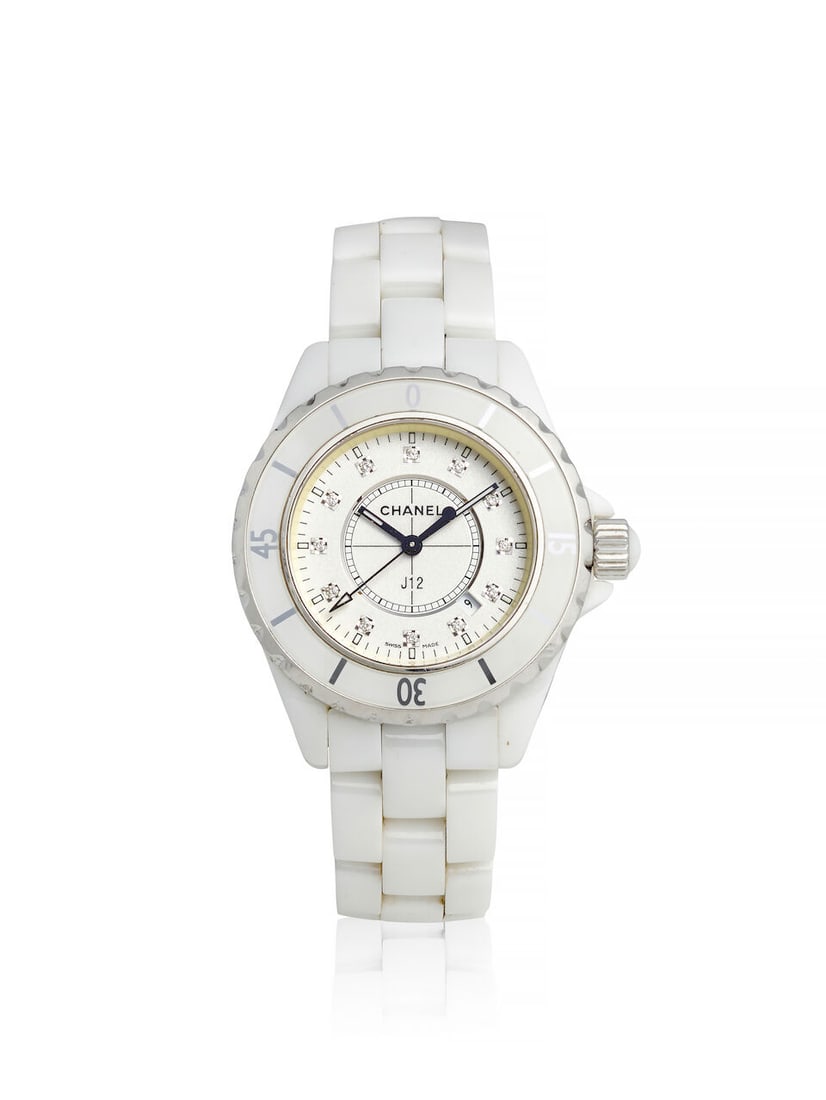 CHANEL. A WHITE CERAMIC QUARTZ CALENDAR BRACELET WATCH J12, c. 2010s: CHANEL. A WHITE CERAMIC QUARTZ CALENDAR BRACELET WATCH Model: J12 Date: c. 2010s Movement: 7-jewel quartz Dial: White, diamond set hour markers Case: Tonneau form, case back secured by 4 screws, no. I