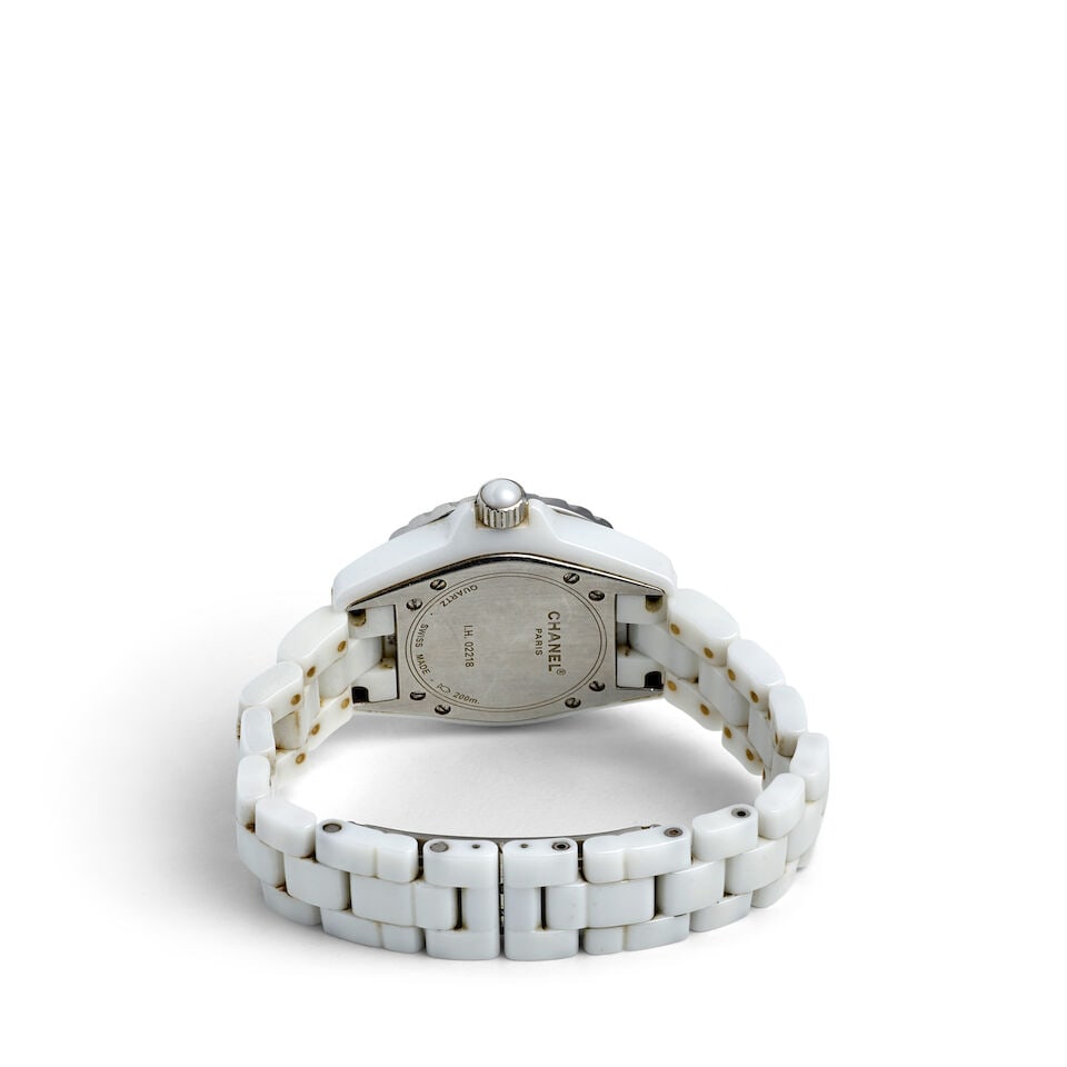 CHANEL. A WHITE CERAMIC QUARTZ CALENDAR BRACELET WATCH J12, c. 2010s - 2