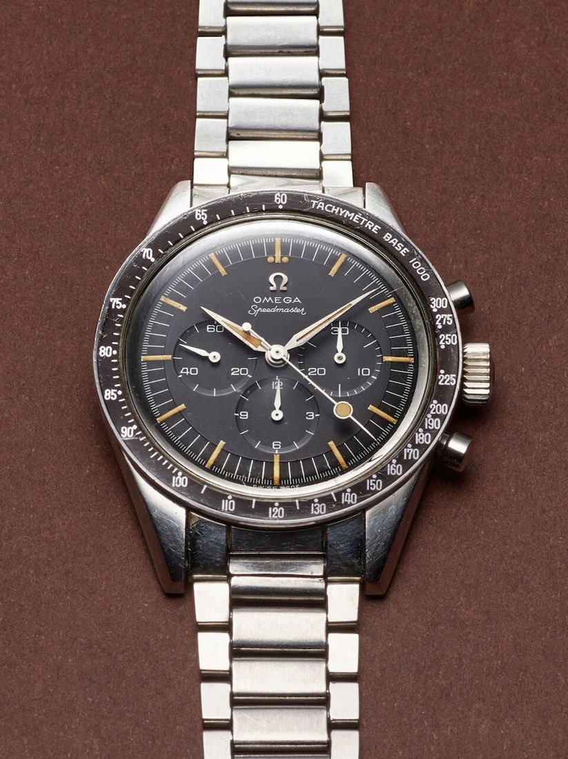 OMEGA. A RARE STAINLESS STEEL MANUAL WIND CHRONOGRAPH WRISTWATCH Speedmaster, Ref: 2998-2, c. 1960s: OMEGA. A RARE STAINLESS STEEL MANUAL WIND CHRONOGRAPH WRISTWATCH Model: Speedmaster Reference: 2998-2 Date: c. 1960s Movement: Cal. 321, 17-jewel manual wind, no. 17'761'410 Dial: Black Case: Tonneau 