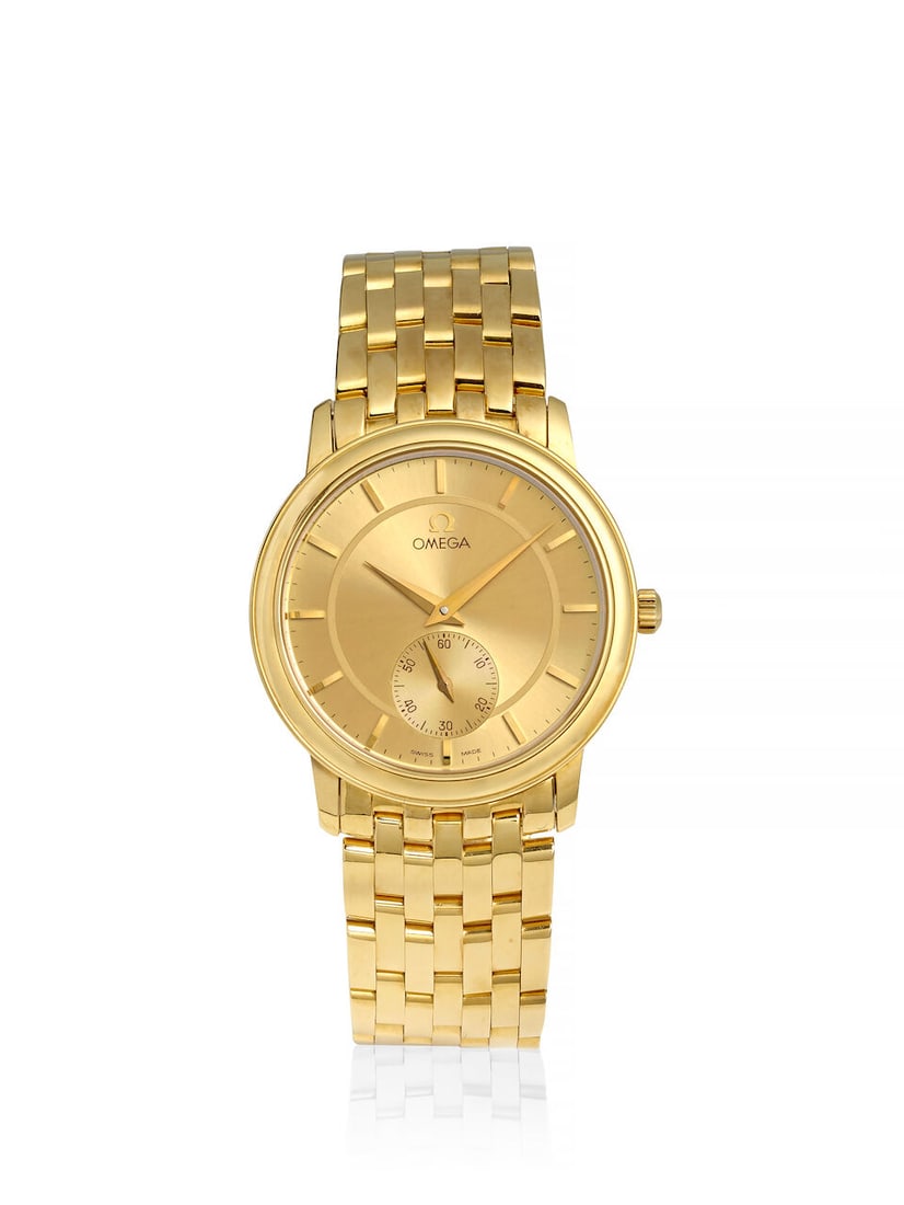 OMEGA. AN ULTRA-THIN 18K GOLD MANUAL WIND BRACELET WATCH De Ville , Ref: 4620.11.01, c. 1994: OMEGA. AN ULTRA-THIN 18K GOLD MANUAL WIND BRACELET WATCH Model: De Ville Reference: 4620.11.01 Date: c. 1994 Movement: Cal. 651, 17-jewel manual wind Dial: Champagne Case: Round, snap on case back, no