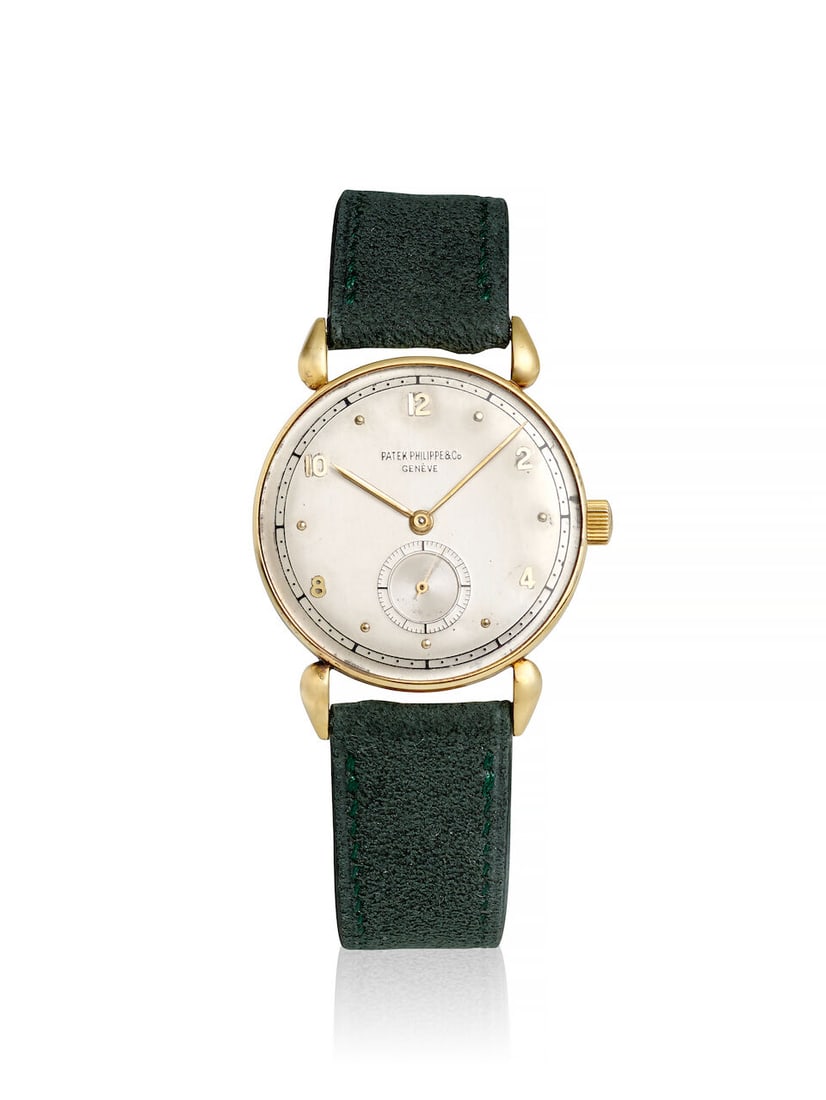 PATEK PHILIPPE. AN 18K GOLD MANUAL WIND WRISTWATCHRef: 590, c. 1945: PATEK PHILIPPE. AN 18K GOLD MANUAL WIND WRISTWATCH Reference: 590 Date: c. 1945 Movement: Cal. 10-105, 19-jewel manual wind, HOX, no. 912'345 Dial: Silvered Case: Round, teardrop lugs, snap on case ba