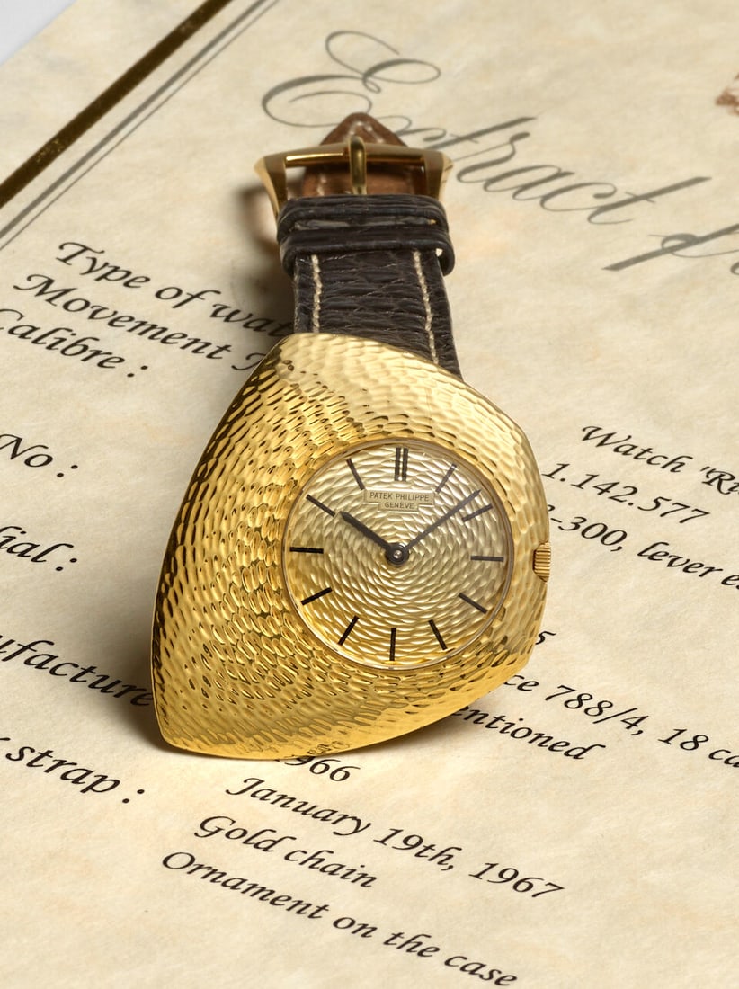 PATEK PHILIPPE. A FINE 18K GOLD ASYMMETRICAL MANUAL WIND CONVERTED WRISTWATCH Ricochet, Ref: 788... (1 of 6)