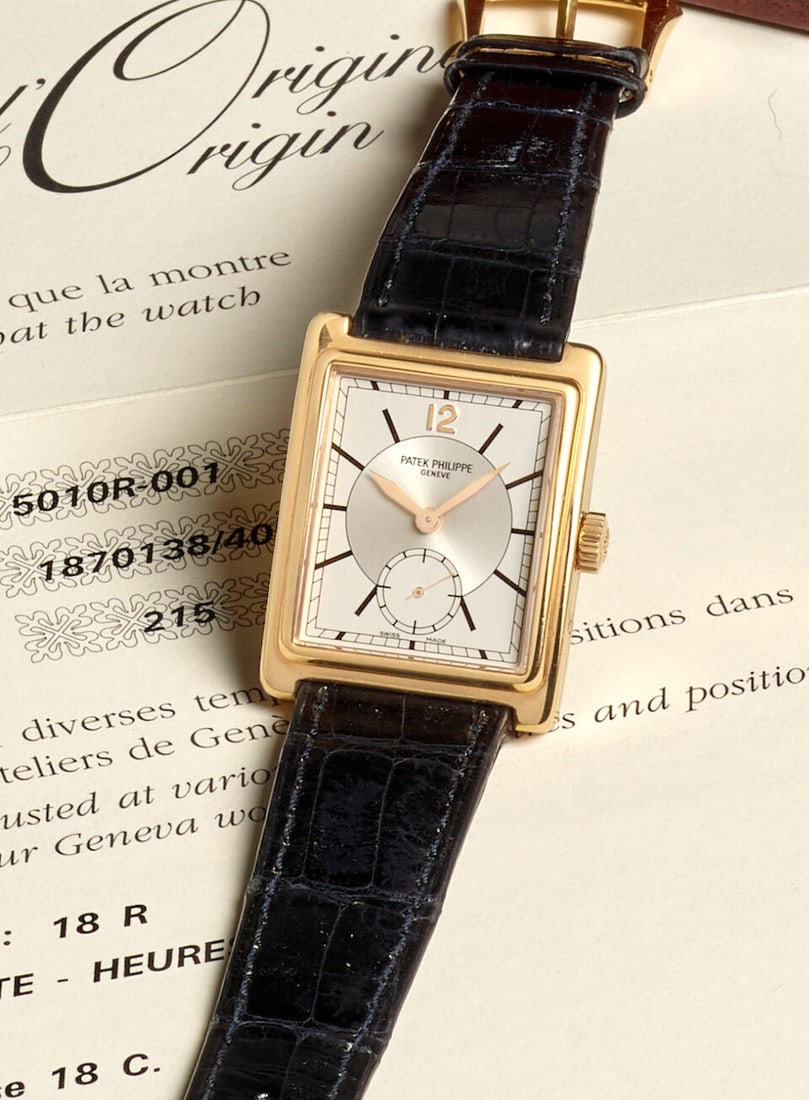 PATEK PHILIPPE. AN 18K ROSE GOLD MANUAL WIND WRISTWATCH Gondole, Ref: 5010R-001, c. 2005: PATEK PHILIPPE. AN 18K ROSE GOLD MANUAL WIND WRISTWATCH Model: Gondole Reference: 5010R-001 Date: c. 2005 Movement: Cal. 215, 18-jewel manual, Geneva Seal, no. 1'870'138 Dial: Silvered Case: