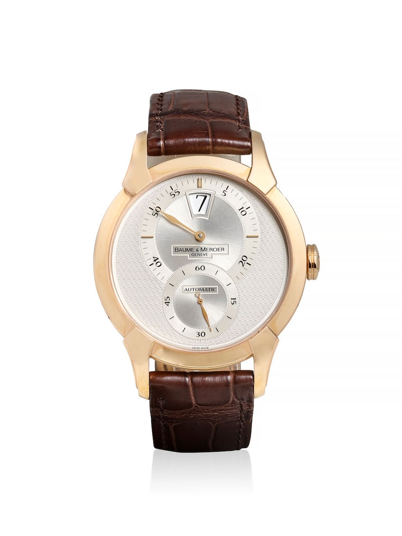 BAUME & MERCIER. AN 18K ROSE GOLD AUTOMATIC JUMP HOUR WRISTWATCH William Baume, Ref: M0A08857, c...: BAUME & MERCIER. AN 18K ROSE GOLD AUTOMATIC JUMP HOUR WRISTWATCH Model: William Baume Reference: M0A08857 Date: c. 2010s Movement: Cal. BM 13400 (ETA 2892-A2), 27-jewel automatic Dial: Textured silver