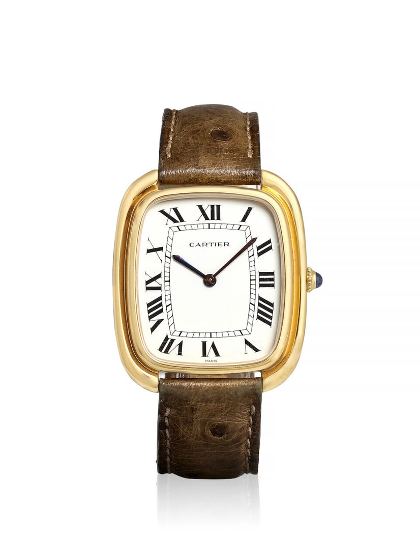 CARTIER. AN 18K GOLD MANUAL WIND WRISTWATCH Gondole 'Jumbo Vertical', Ref: 97050, c. 1970s: CARTIER. AN 18K GOLD MANUAL WIND WRISTWATCH Model: Gondole 'Jumbo Vertical' Reference: 97050 Date: c. 1970s Movement: Cal. 97B, 17-jewel Dial: White Case: Cushion form, case back secured by 4 screws, 