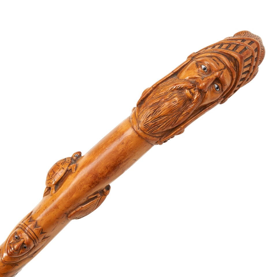 Carved and Inlaid Boxwood Walking Stick Depicting a Knight France, 18th century: Carved and Inlaid Boxwood Walking Stick Depicting a Knight France, 18th century The handle carved to depict a monkey head with open mouth, emerging from the face of a bearded man wearing medieval armo
