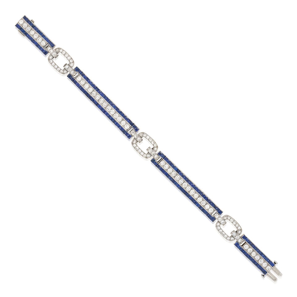 BLACK STARR & FROST: AN ART DECO PLATINUM, SAPPHIRE, AND DIAMOND BRACELET: BLACK STARR & FROST: AN ART DECO PLATINUM, SAPPHIRE, AND DIAMOND BRACELET Set with old European and transitional-cut diamonds, approximate total weight 3.50 carats, bordered by fancy-cut sapphires, mi