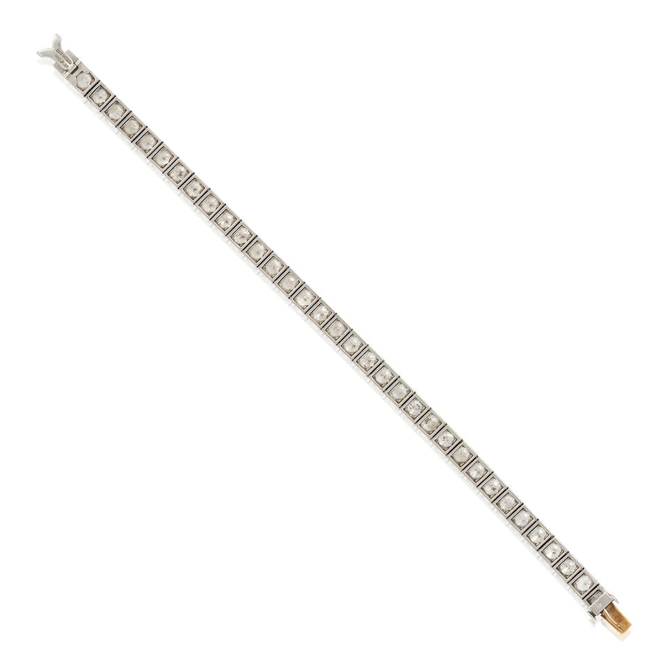 TIFFANY & CO.: AN ART DECO PLATINUM AND DIAMOND LINE BRACELET - 4