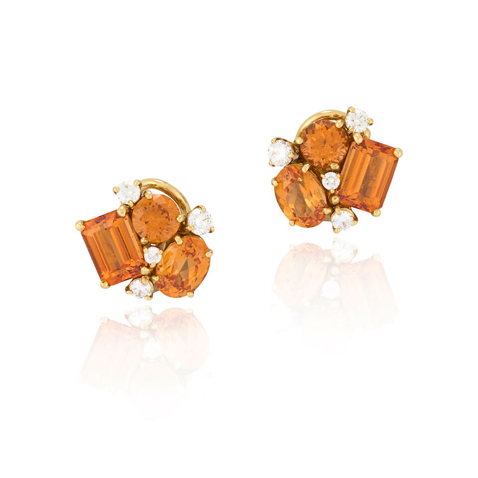 DONNA VOCK: A PAIR OF 18K GOLD, GARNET, AND DIAMOND EARCLIPS: DONNA VOCK: A PAIR OF 18K GOLD, GARNET, AND DIAMOND EARCLIPS Designed as a cluster of fancy and circular-cut mandarin garnets, with full-cut diamond accents, weight 5.3 dwt, maker's mark for Donna