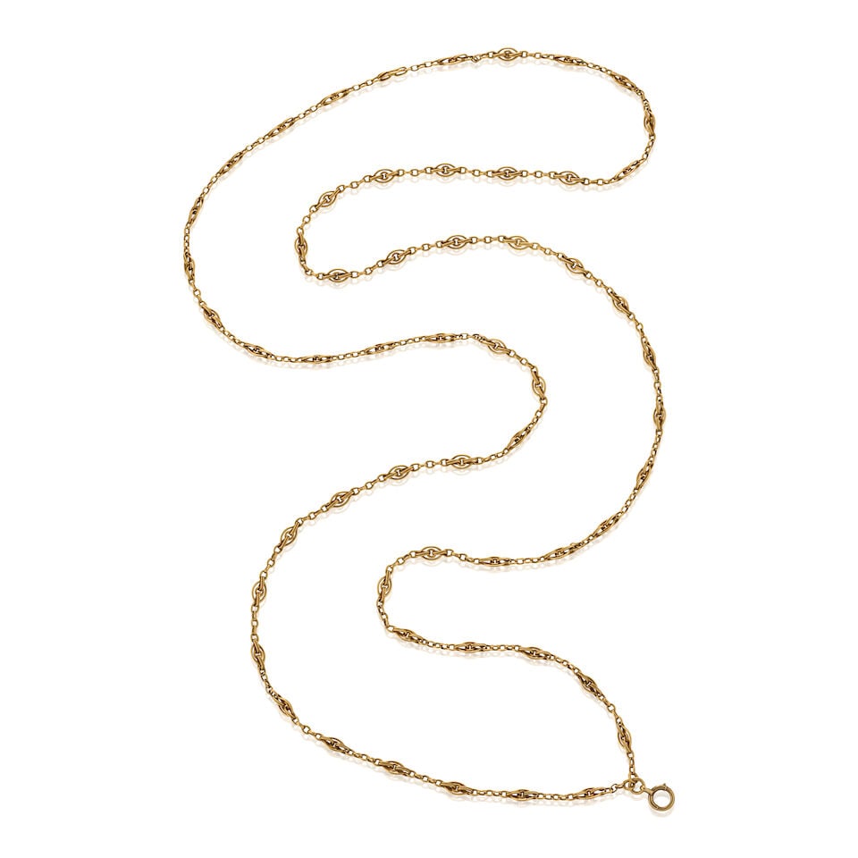 AN ANTIQUE 18K GOLD LONG CHAIN, FRANCE: AN ANTIQUE 18K GOLD LONG CHAIN, FRANCE Composed of fancy links, weight 36.7 dwt, French maker's mark and guarantee stamps, length 59 1/2 in. For further information on this lot please visit