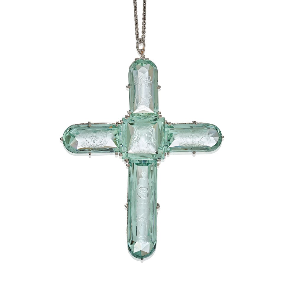 TIFFANY & CO.: AN ANTIQUE PLATINUM AND BERYL INTAGLIO CROSS PENDANT, CIRCA 1910: TIFFANY & CO.: AN ANTIQUE PLATINUM AND BERYL INTAGLIO CROSS PENDANT, CIRCA 1910 The cross composed of five finely carved beryl intaglios, the center depicting the Virgin Mary, with winged cherub heads