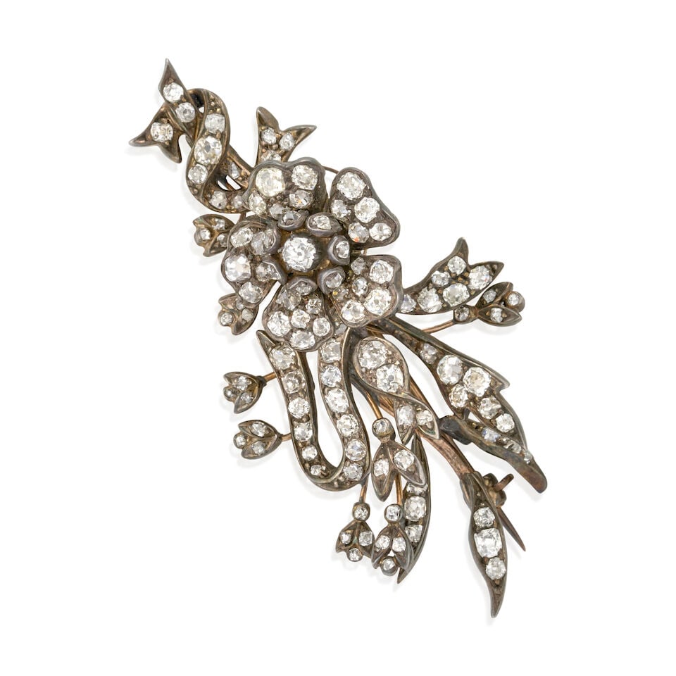 AN ANTIQUE DIAMOND 'EN TREMBLANT' FLOWER BROOCH: AN ANTIQUE DIAMOND 'EN TREMBLANT' FLOWER BROOCH The floral spray set with old mine, old single, and rose-cut diamonds, approximate total weight 3.00 carats, silver-topped gold mount, weight 7.7 dwt,