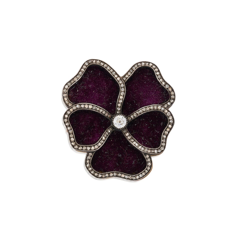 AN ANTIQUE DIAMOND AND VELVET PANSY BROOCH: AN ANTIQUE DIAMOND AND VELVET PANSY BROOCH Centering an old European-cut diamond, framed by purple velvet petals with rose-cut diamond borders, in silver topped-gold, weight 5.4 dwt, Continental