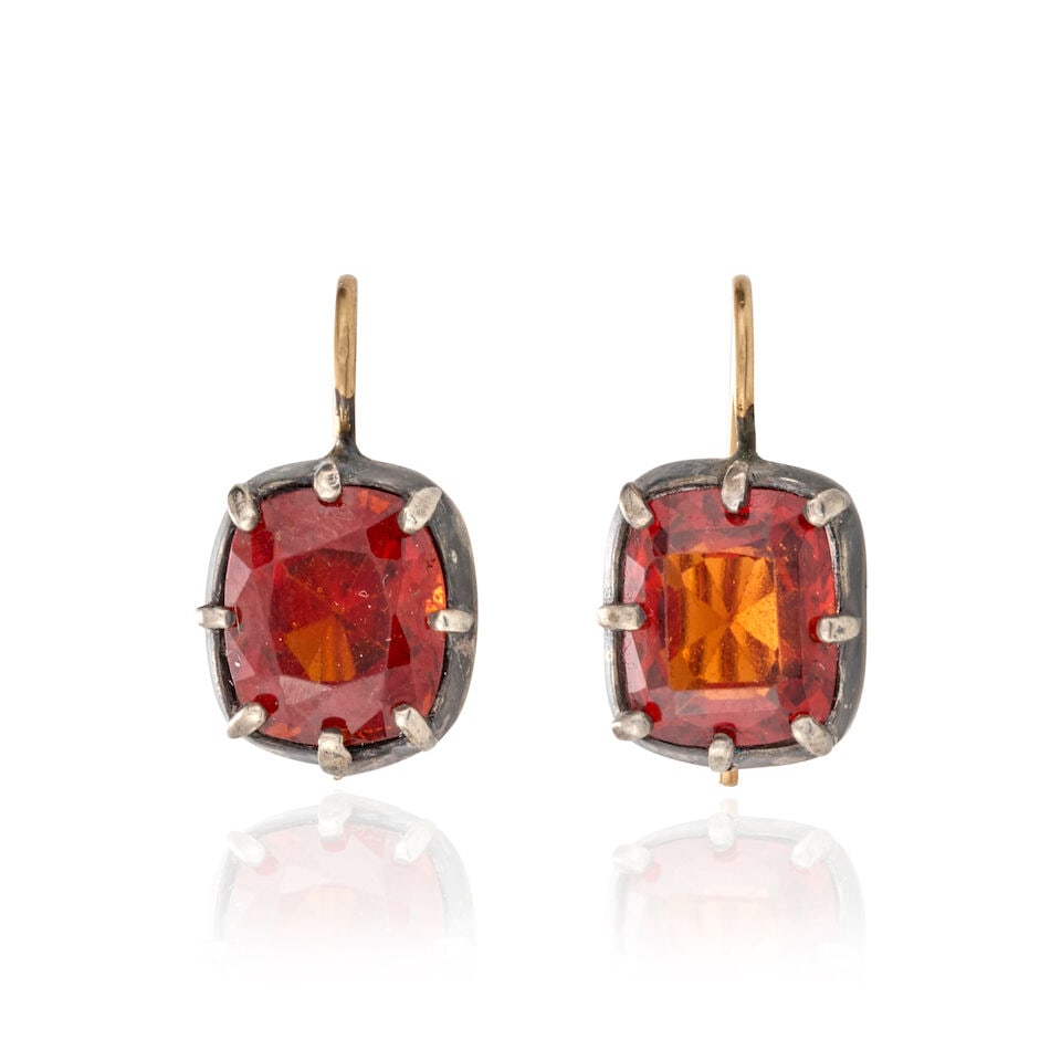 A PAIR OF GARNET EARRINGS: A PAIR OF GARNET EARRINGS Each centering a fancy-cut garnet measuring approximately 10.25 x 8.70 x 6.15 mm, mounted in silver, gross weight 3.2 dwt, length 3/4 in. For further information on this lot