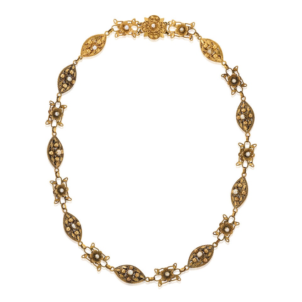 AN ANTIQUE GOLD AND PEARL NECKLACE: AN ANTIQUE GOLD AND PEARL NECKLACE The fancy-shaped filigree links set with pearls, applied floral and geometric motifs, weight 27.8 dwt, length 18 1/2 in. Footnotes: Please note that the pearls have