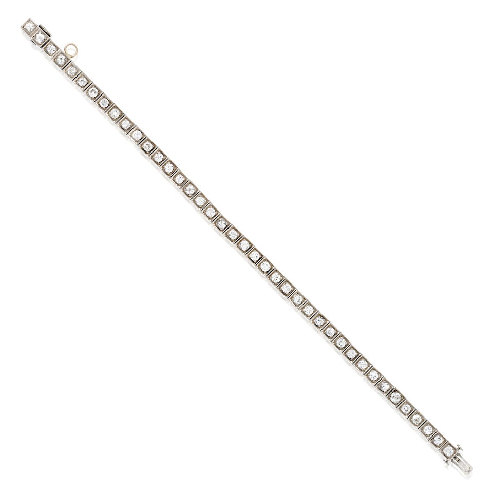 AN ART DECO PLATINUM AND DIAMOND BRACELET: AN ART DECO PLATINUM AND DIAMOND BRACELET Set with old European, transitional, and full-cut diamonds, approximate total weight 3.50 carats, weight 11.1 dwt, length 7 1/4 in. For further information