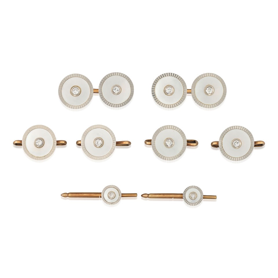 CARTIER: AN ART DECO MOTHER-OF-PEARL AND DIAMOND DRESS SET: CARTIER: AN ART DECO MOTHER-OF-PEARL AND DIAMOND DRESS SET Comprising a pair of cufflinks, four vest buttons, and two shirt studs, each with mother-of-pearl centering old European-cut diamonds, in pla