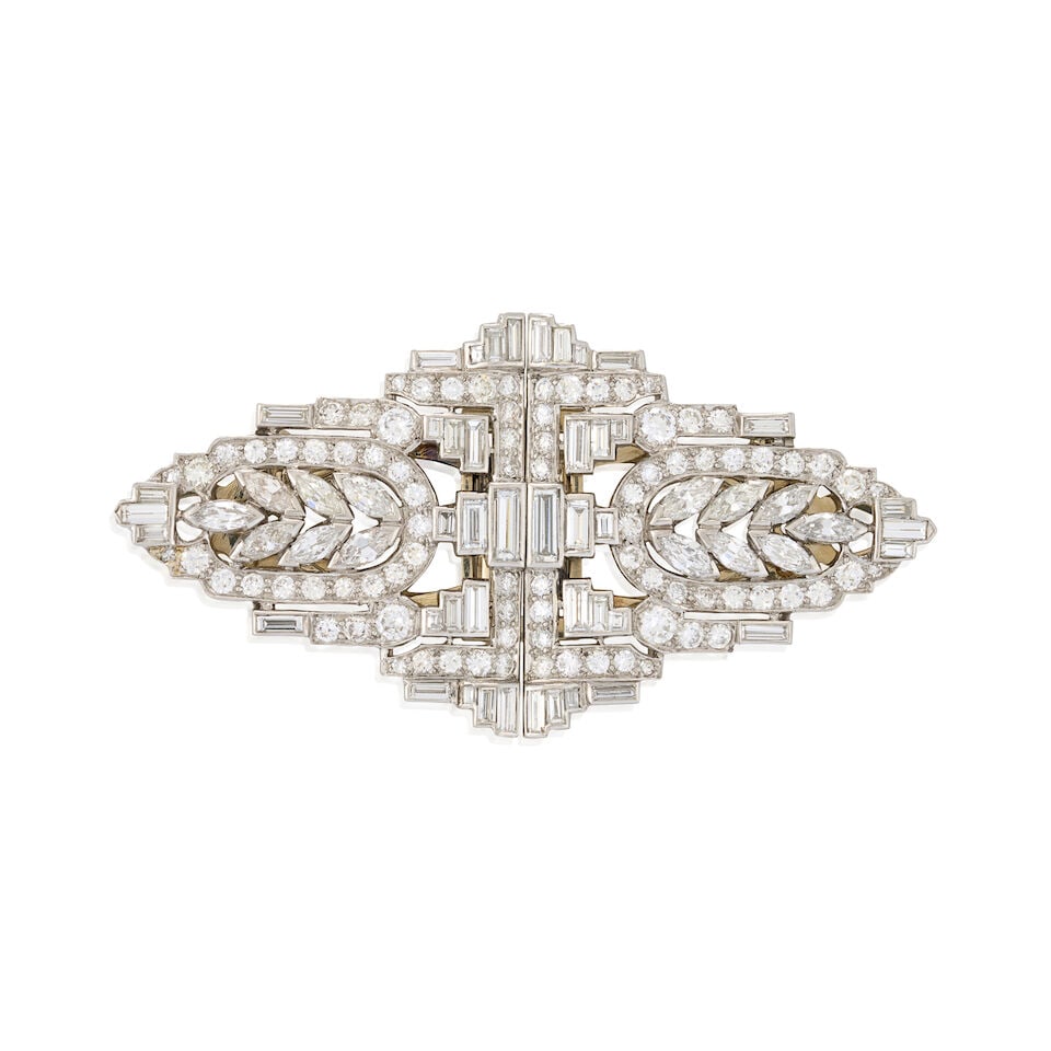 A PAIR OF PLATINUM AND DIAMOND CLIP BROOCHES, CIRCA 1940: A PAIR OF PLATINUM AND DIAMOND CLIP BROOCHES, CIRCA 1940 Set with old European, full, baguette, and old marquise-cut diamonds, approximate total weight 7.35 carats, with findings for brooch conversion