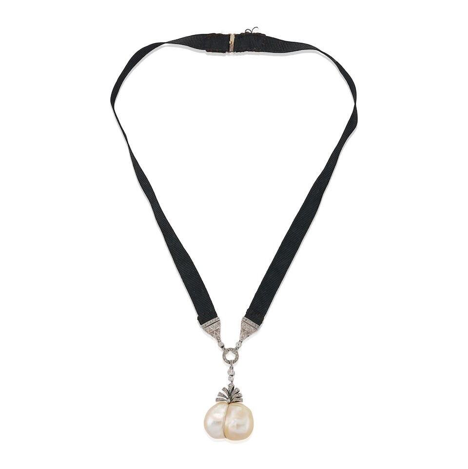 AN EDWARDIAN PLATINUM, BAROQUE PEARL, AND DIAMOND NECKLACE: AN EDWARDIAN PLATINUM, BAROQUE PEARL, AND DIAMOND NECKLACE The removeable pendant suspending a large baroque pearl drop measuring approximately 24.00 x 18.25 x 13.50 mm, with rose, old single, and old