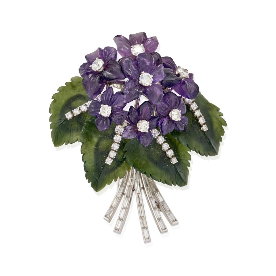A PLATINUM, CARVED GEMSTONE, AND DIAMOND FLOWER BROOCH: A PLATINUM, CARVED GEMSTONE, AND DIAMOND FLOWER BROOCH Designed as a nosegay of carved amethyst flowers centering full and old European-cut diamonds, with carved nephrite leaves set with full-cut