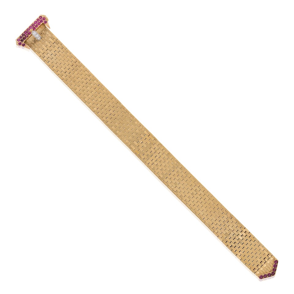 A RETRO GOLD, RUBY, AND DIAMOND BUCKLE BRACELET: A RETRO GOLD, RUBY, AND DIAMOND BUCKLE BRACELET Composed of brickwork links, with clasp designed as a buckle set with circular-cut rubies and transitional and full-cut diamonds, weight 25.9 dwt,