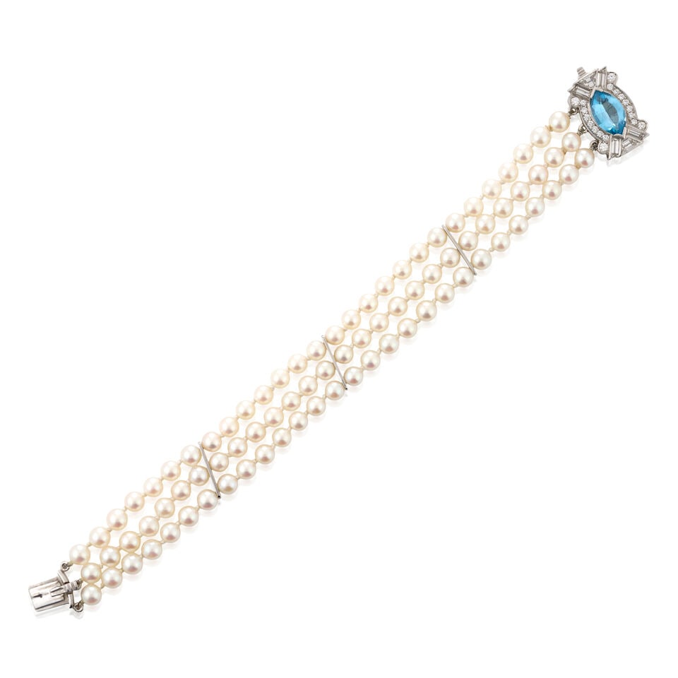 RAYMOND YARD: A CULTURED PEARL, BLUE TOPAZ, AND DIAMOND BRACELET: RAYMOND YARD: A CULTURED PEARL, BLUE TOPAZ, AND DIAMOND BRACELET Composed of three strands of cultured pearls, ranging in size from approximately 4.50 to 4.90 mm, completed by a clasp centering a