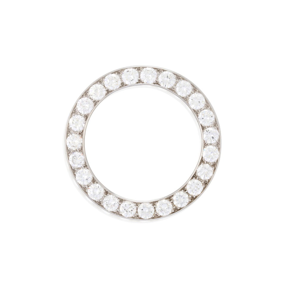A PLATINUM AND DIAMOND CIRCLE PIN: A PLATINUM AND DIAMOND CIRCLE PIN Set with full-cut diamonds, approximate total weight 3.45 carats, weight 3.5 dwt, length 1 1/4 in. For further information on this lot please visit Bonhams.com For