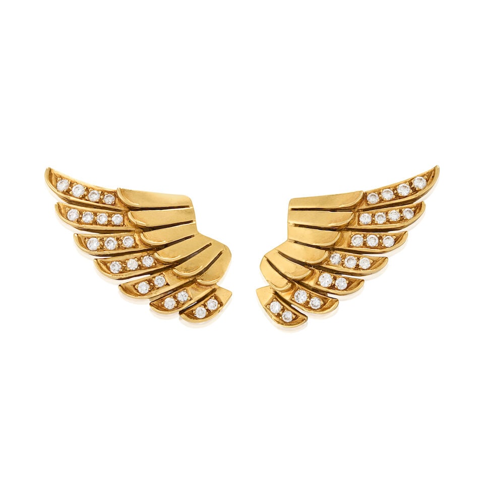 A PAIR OF 18K GOLD AND DIAMOND EARRINGS: A PAIR OF 18K GOLD AND DIAMOND EARRINGS Designed as stylized wings set with full-cut diamonds, approximate total weight 1.45 carats, weight 20.5 dwt, length 1 11/16 in. For further information on