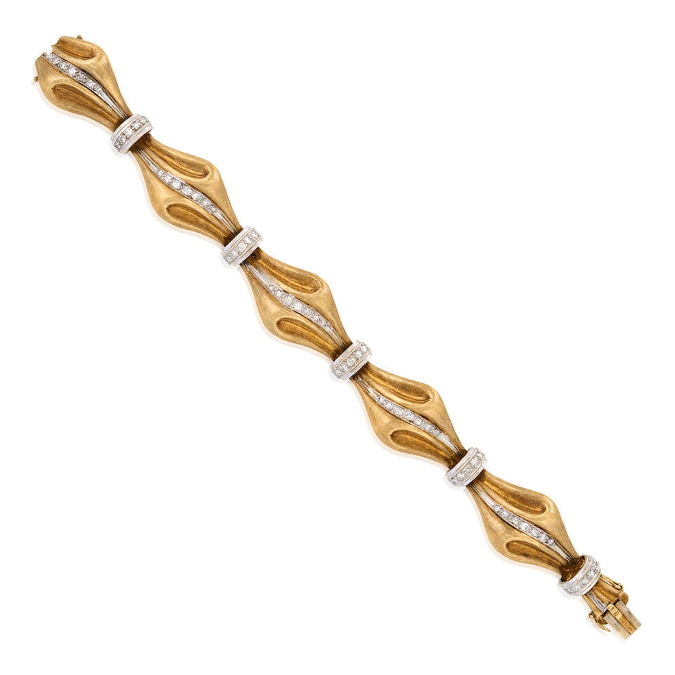 AN 18K BICOLOR GOLD AND DIAMOND BRACELET: AN 18K BICOLOR GOLD AND DIAMOND BRACELET Designed as textured gold bows set with single-cut diamonds, weight 38.8 dwt, length 6 3/4 in. For further information on this lot please visit