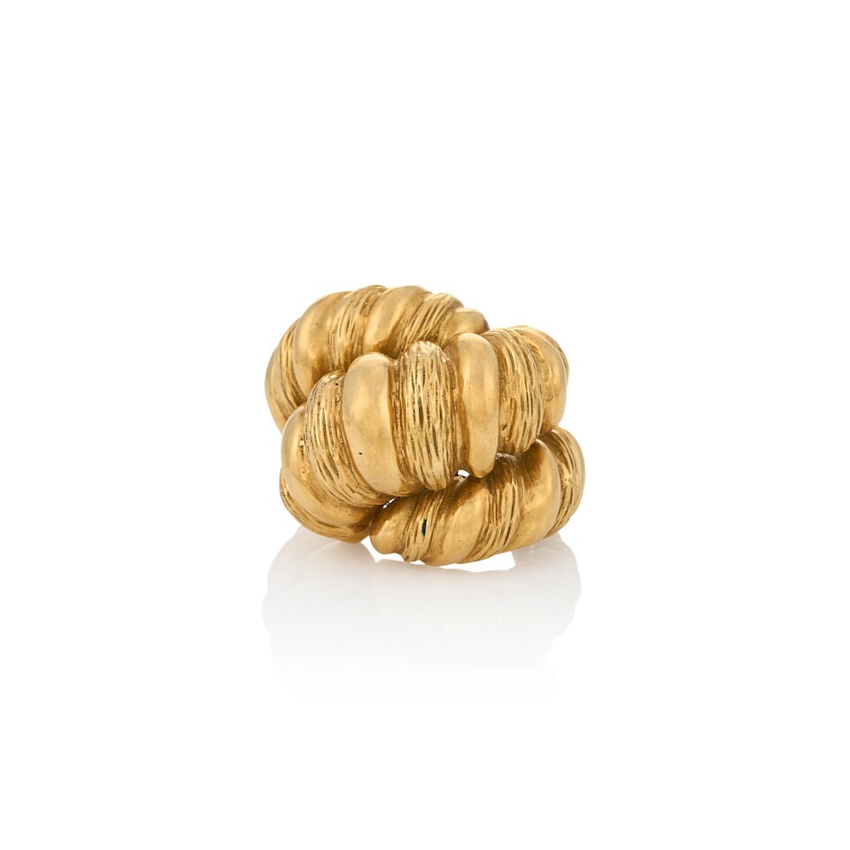 A LARGE 18K GOLD RING: A LARGE 18K GOLD RING Designed as a large gadrooned gold shrimp ring, weight 19.9 dwt, approximately size 6 1/2. For further information on this lot please visit Bonhams.com For further information