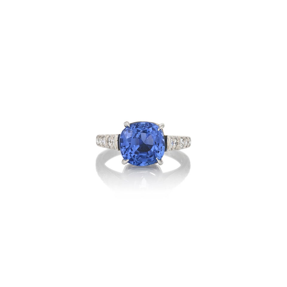 A SAPPHIRE AND DIAMOND RING: A SAPPHIRE AND DIAMOND RING Centering a fancy-cut sapphire weighing 6.81 carats, with full-cut diamond shoulders, platinum mount, weight 4.7 dwt, size 5 3/4. Footnotes: Accompanied by an AGL report