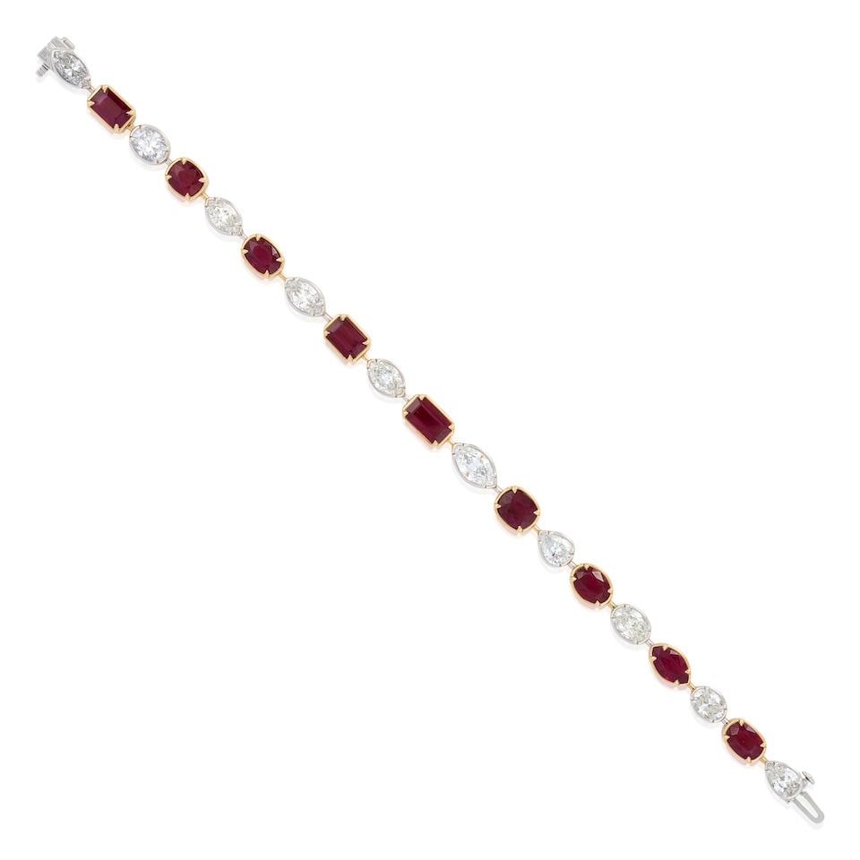 A 14K BI-COLOR GOLD, RUBY, AND DIAMOND BRACELET: A 14K BI-COLOR GOLD, RUBY, AND DIAMOND BRACELET Set with fancy-cut rubies, total weight 10.13 carats, and pear, marquise, and oval-cut diamonds, total weight 5.73 carats, set in rose and white gold,