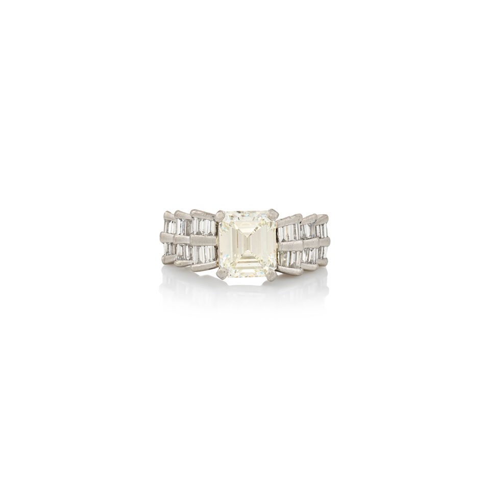 A PLATINUM AND DIAMOND SOLITAIRE: A PLATINUM AND DIAMOND SOLITAIRE Centering an emerald-cut diamond weighing 1.77 carats, with tiered tapered baguette-cut diamond shoulders, weight 4.7 dwt, size 4 1/4. Footnotes: Accompanied by a GIA 