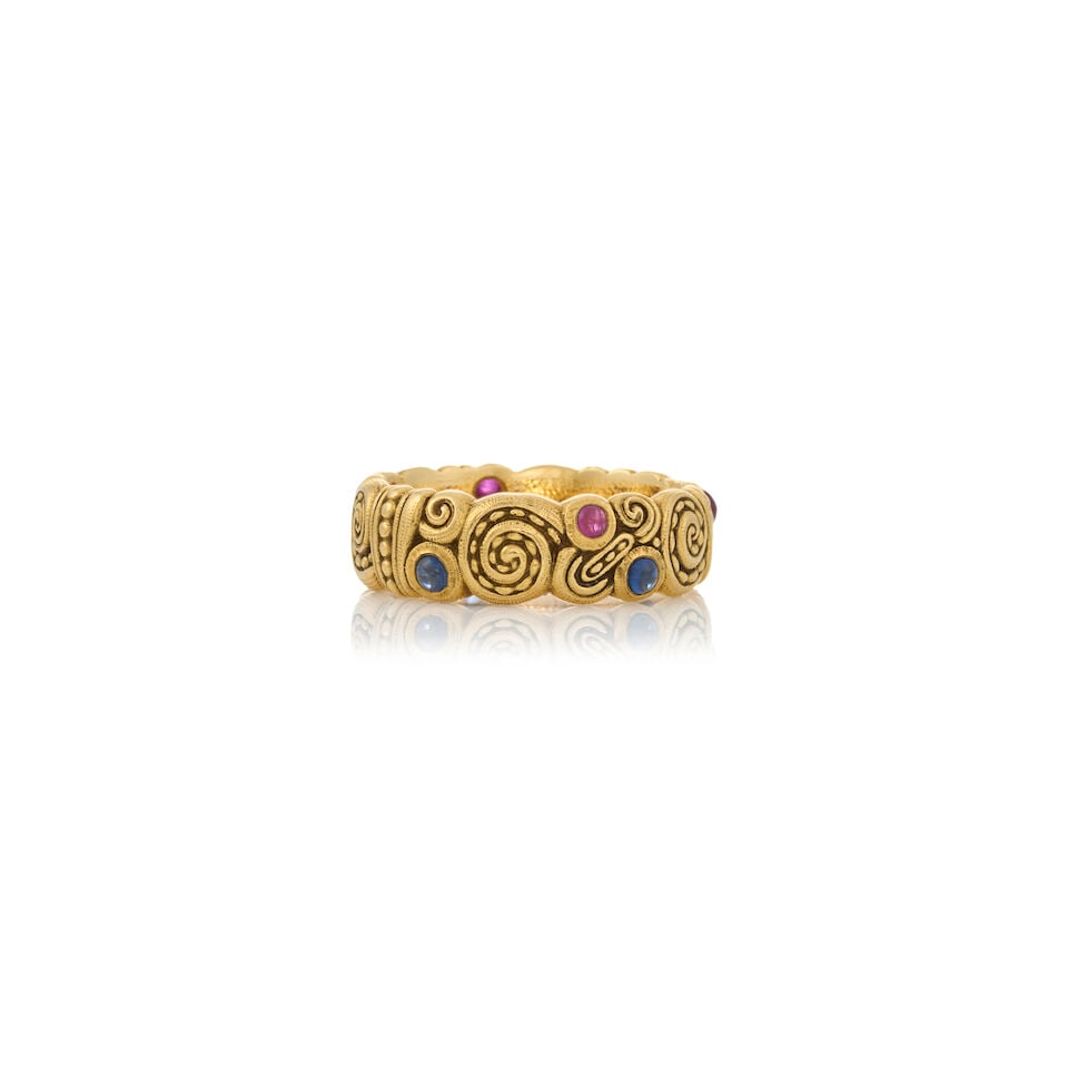 ATTRIBUTED TO ALEX SEPKUS: AN 18K GOLD, SAPPHIRE, AND RUBY 'NAUTILUS' RING: ATTRIBUTED TO ALEX SEPKUS: AN 18K GOLD, SAPPHIRE, AND RUBY 'NAUTILUS' RING Bezel-set with sapphire and ruby cabochons, weight 6.0 dwt, unsigned, size 6 3/4. Footnotes: Purchased by the consignor at Al