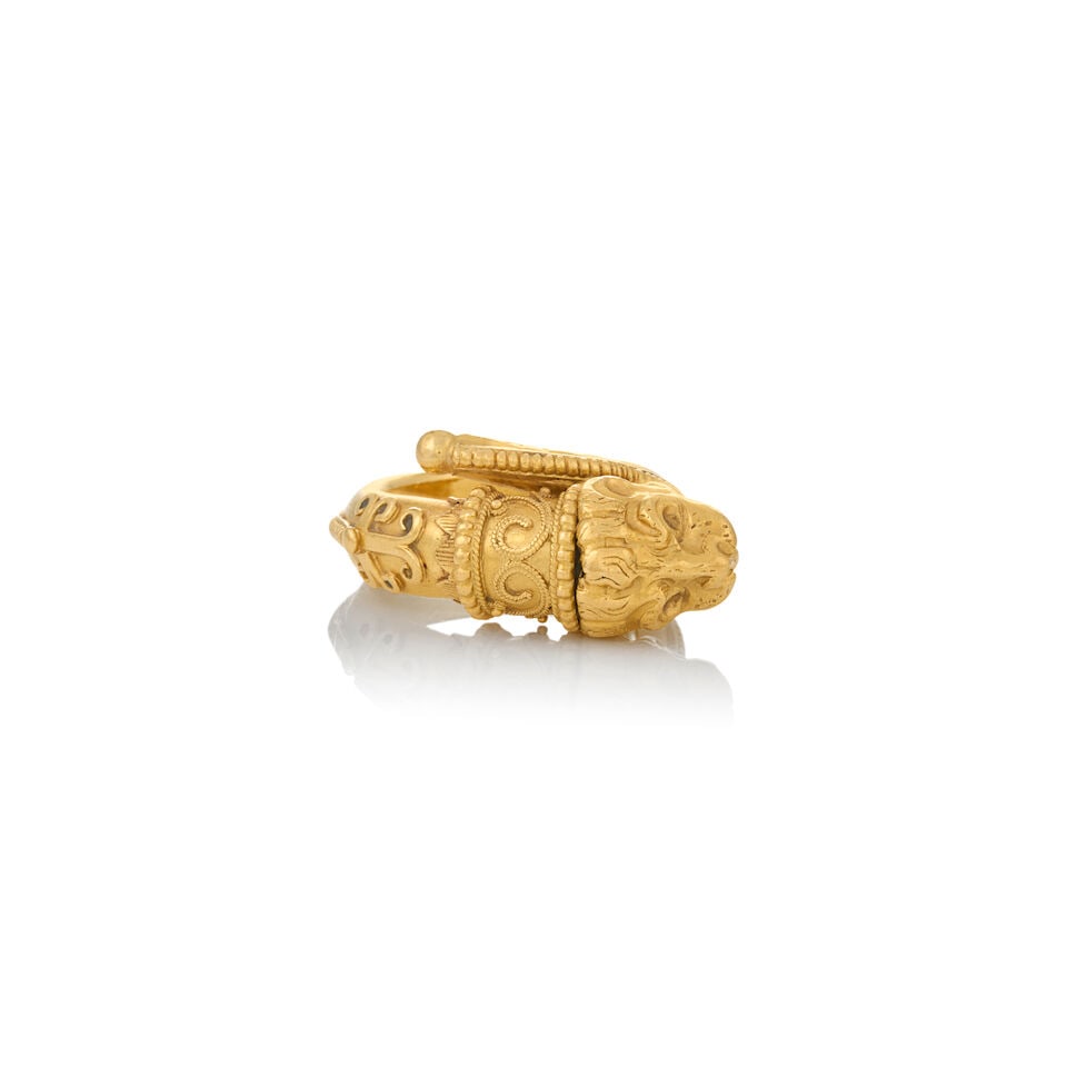 ZOLOTAS: A 22K GOLD LION RING - 6