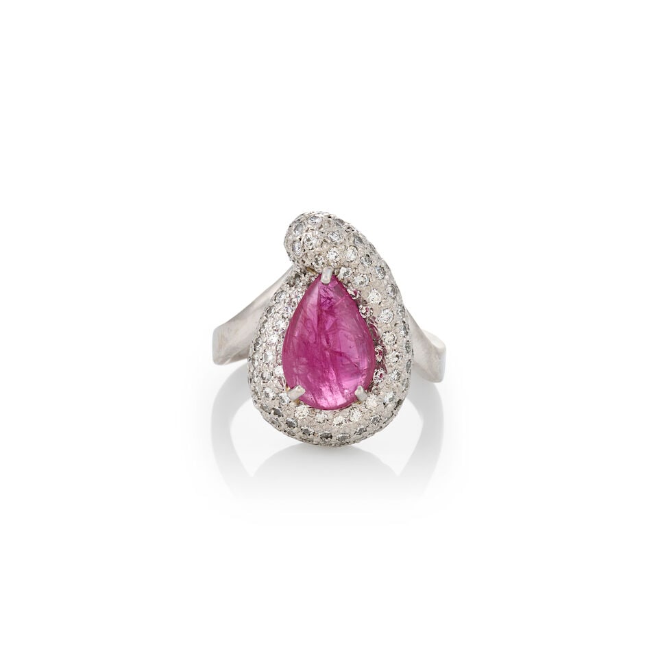 A PLATINUM, RUBY, AND DIAMOND RING: A PLATINUM, RUBY, AND DIAMOND RING Centering a pear-shaped cabochon ruby weighing 3.48 carats, framed by pave-set full-cut diamonds, approximate total diamond weight 1.25 carats, weight 12.8 dwt,