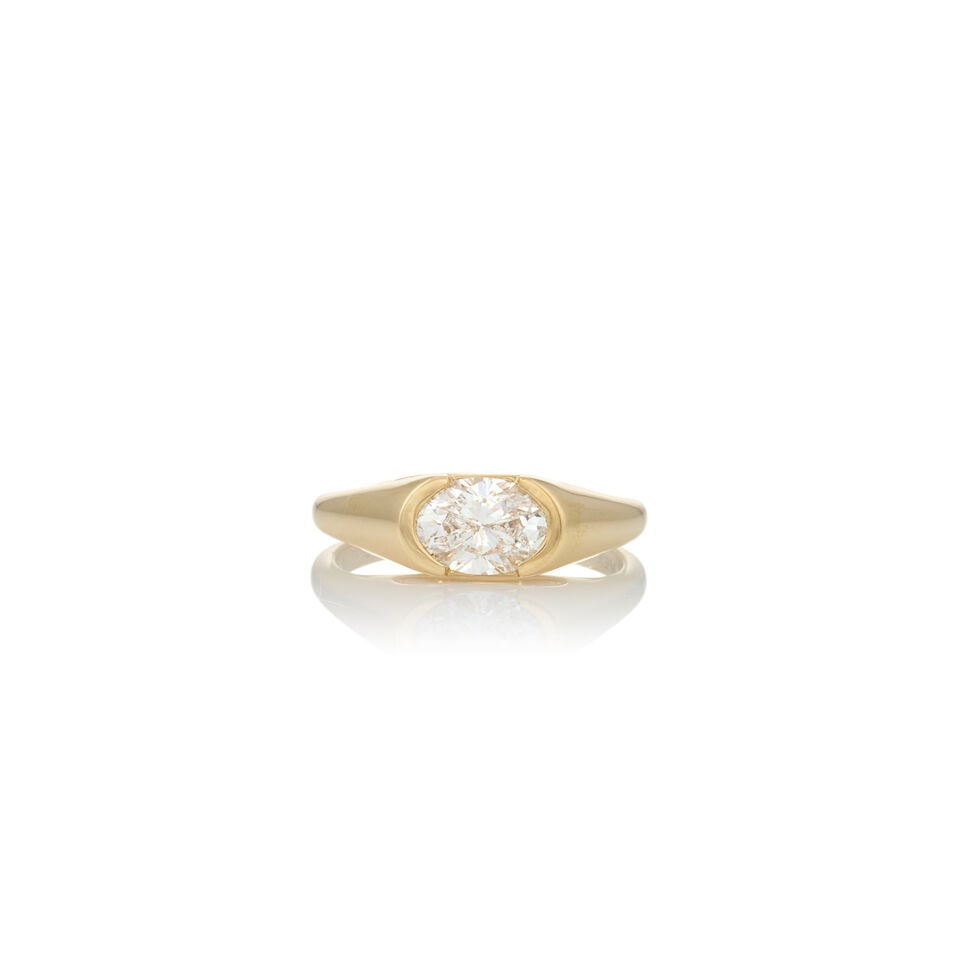A 14K GOLD AND DIAMOND RING: A 14K GOLD AND DIAMOND RING Centering a side-set, oval brilliant-cut diamond weighing 1.08 carats, weight 2.4 dwt, size 6 1/4. Footnotes: Accompanied by a GIA report numbered 6237648365, dated July