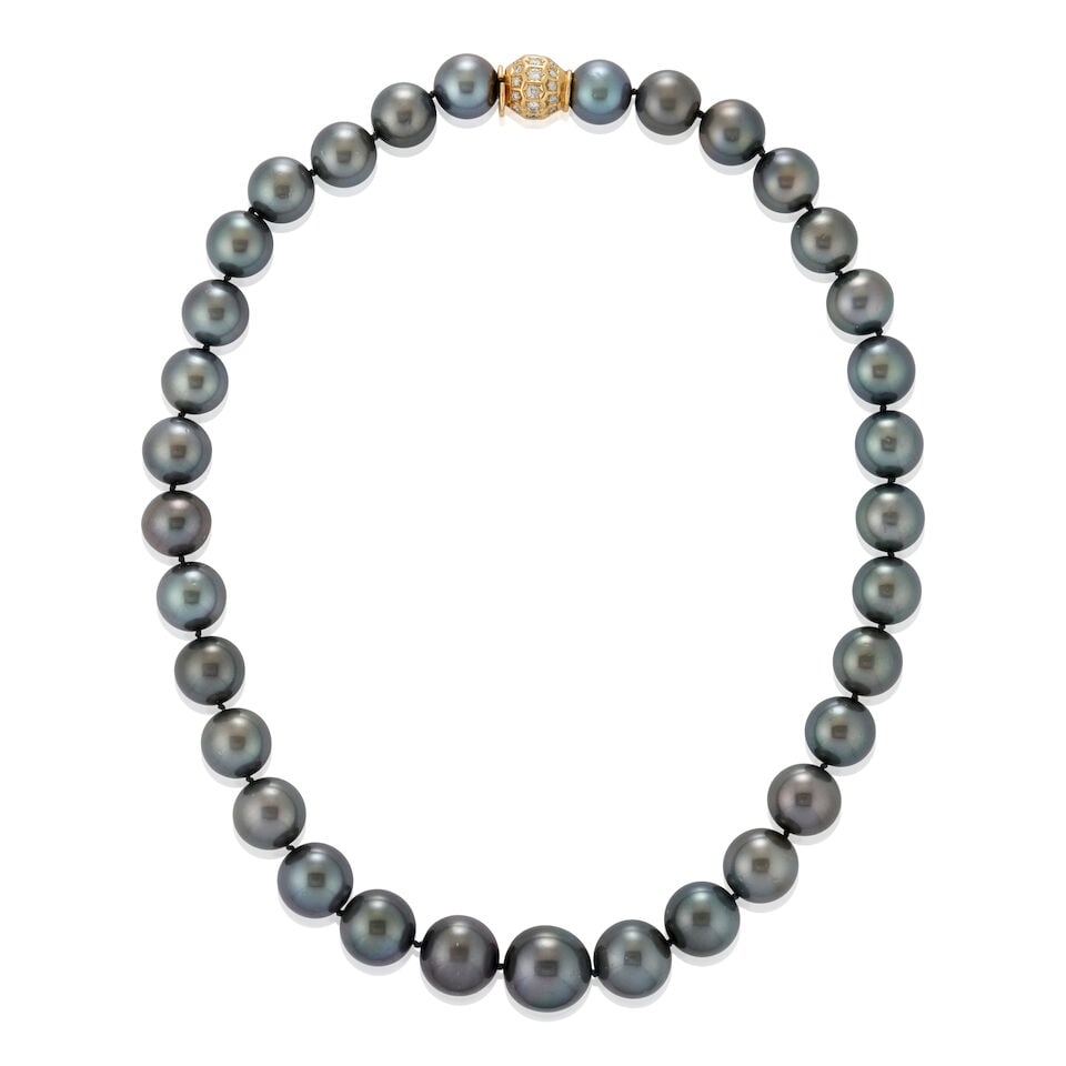 A TAHITIAN PEARL NECKLACE: A TAHITIAN PEARL NECKLACE Composed of thirty-three pearls graduating in size from approximately 12.50 to 16.10 mm, completed by an 18k gold boule clasp set with full-cut diamonds, approximate total