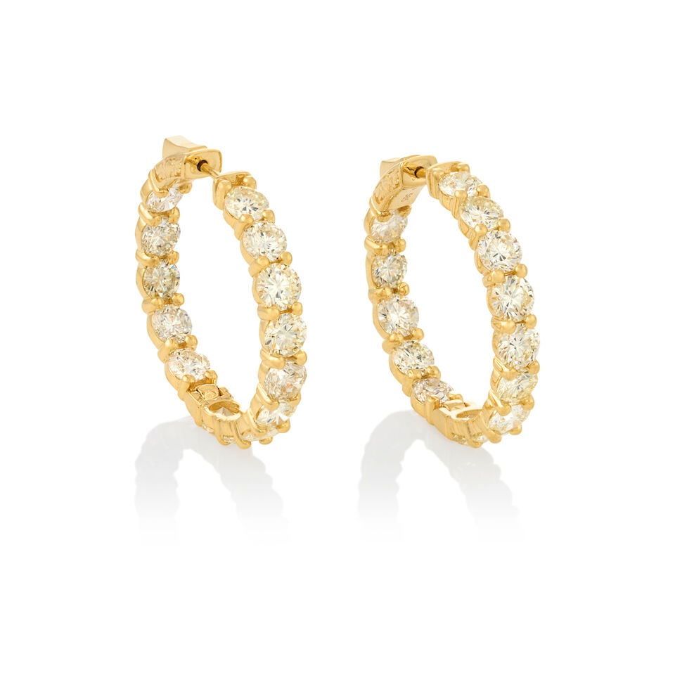 A PAIR OF 14K GOLD AND DIAMOND HOOP EARRINGS: A PAIR OF 14K GOLD AND DIAMOND HOOP EARRINGS Set with full-cut diamonds, total weight 11.00 carats, weight 8.9 dwt, length 1 3/16 in. For further information on this lot please visit Bonhams.com For