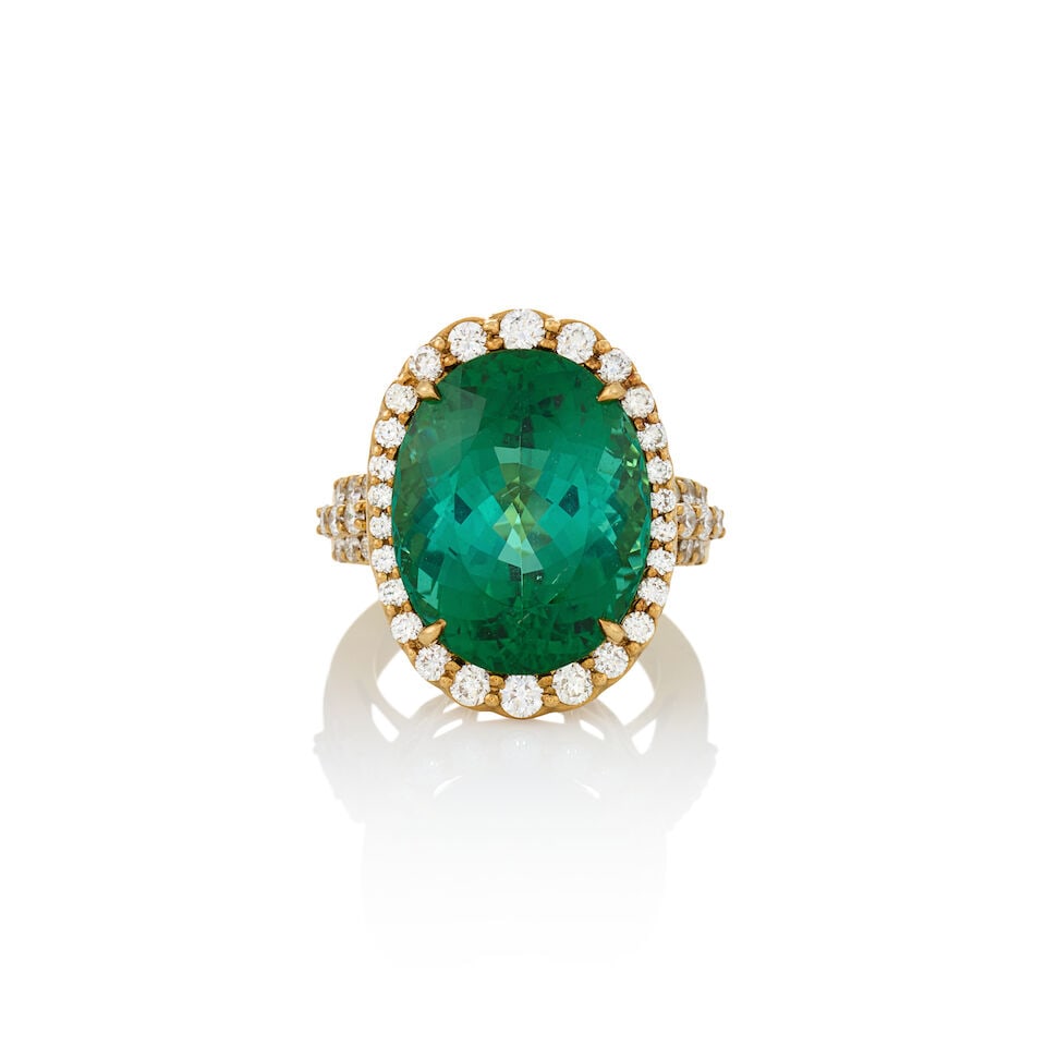 AN 18K GOLD, TOURMALINE, AND DIAMOND RING: AN 18K GOLD, TOURMALINE, AND DIAMOND RING Centering a fancy-cut tourmaline measuring approximately 18.50 x 14.65 x 10.55 mm, framed by full-cut diamonds, approximate total diamond weight 1.12 carats,